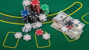 Live blackjack table on mobile phone screen showing dealer and player cards